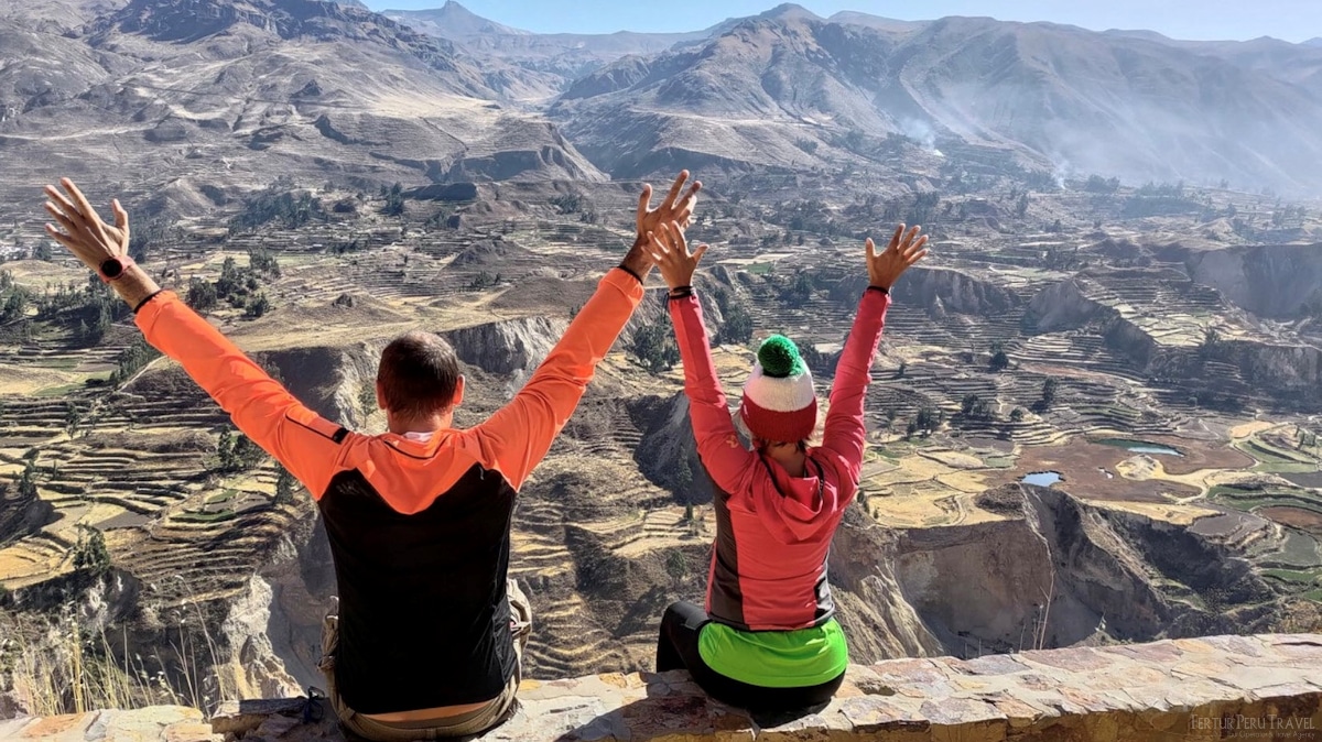 travelers enjoy a magnificent view of the Colca Canyon