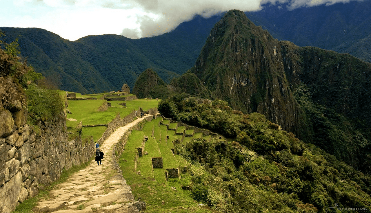 Inti Punku Sun Gate Machu Picchu: Hike to the Sun Gate viewpoint and walk back through the ancient citadel. Stunning Andes views on historic stone pathways.